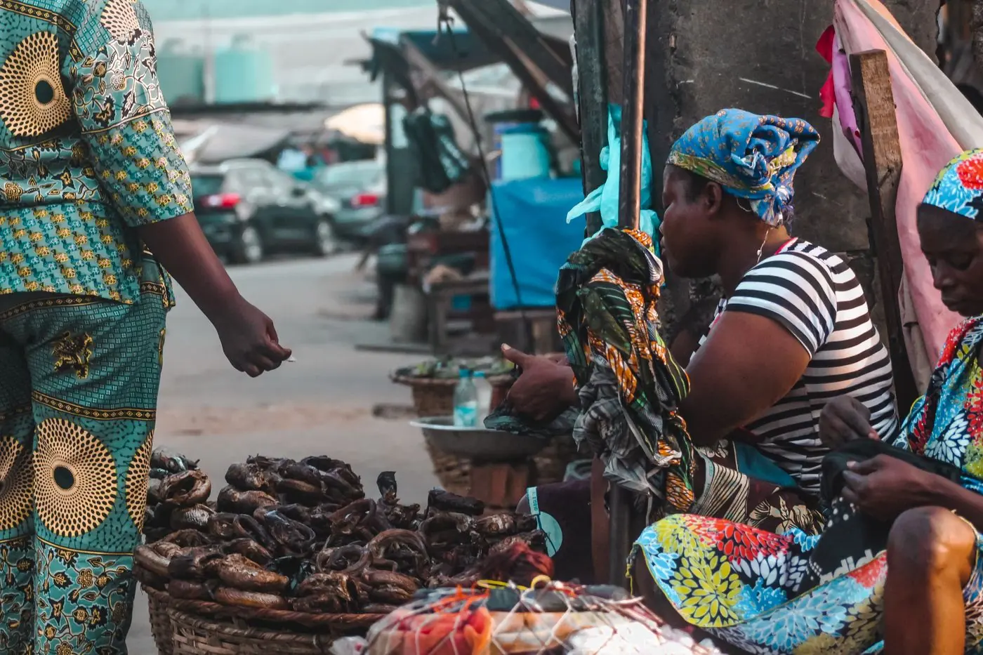 Vendors selling goods at a busy outdoor market