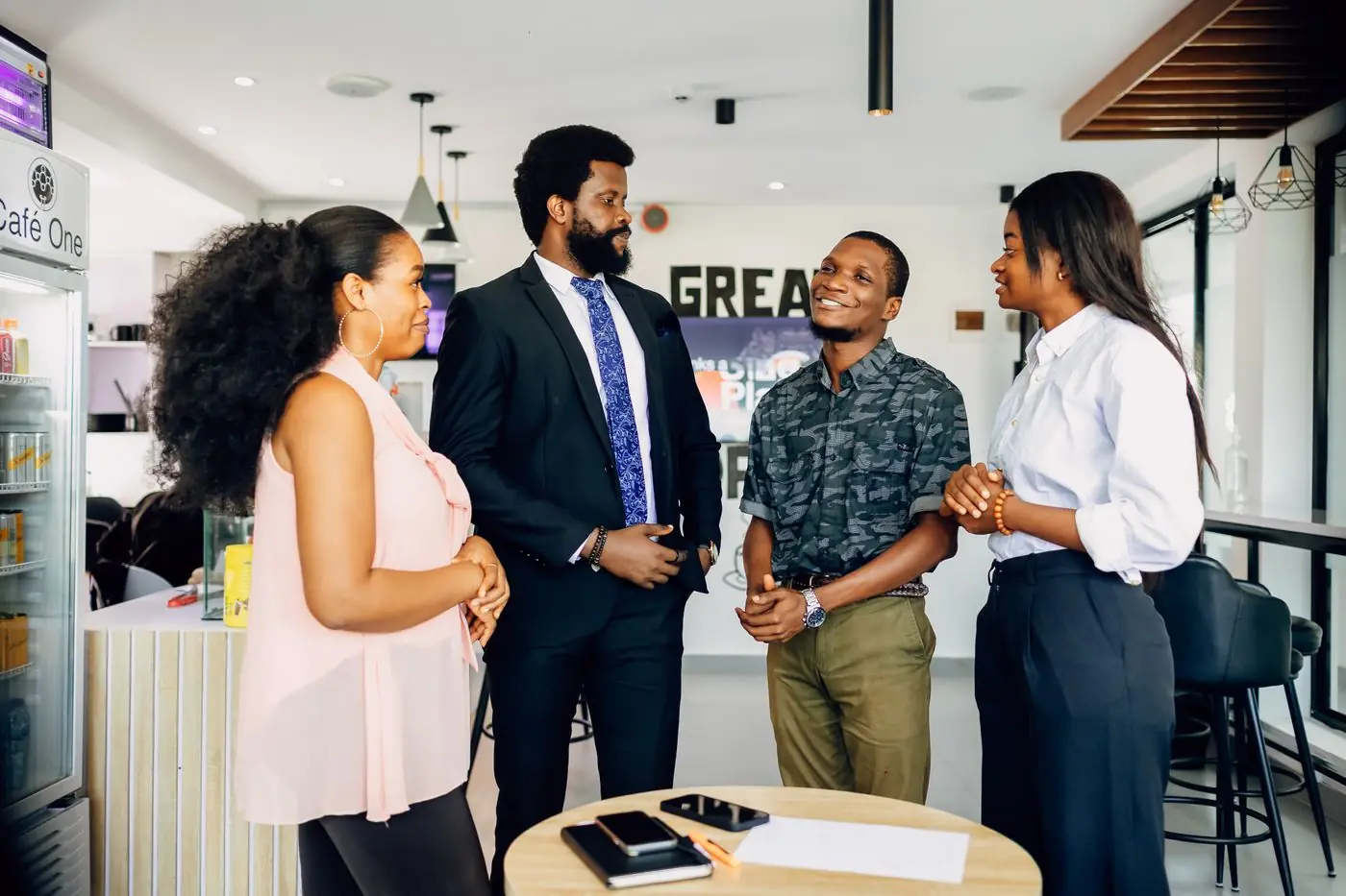 Colleagues talking in a bright office